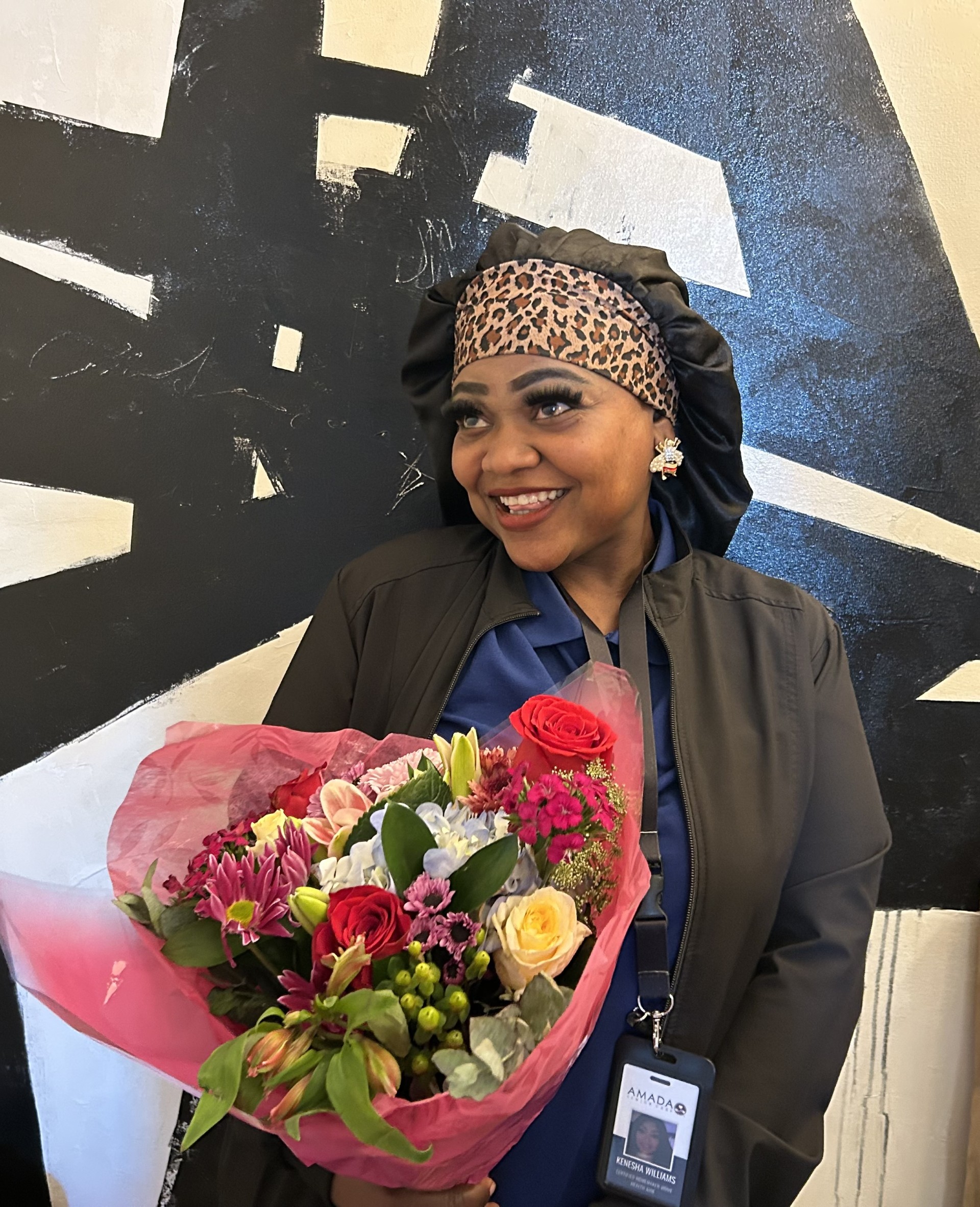 Kenesha, Caregiver of the Quarter for June 2026, posing for a professional portrait photo.