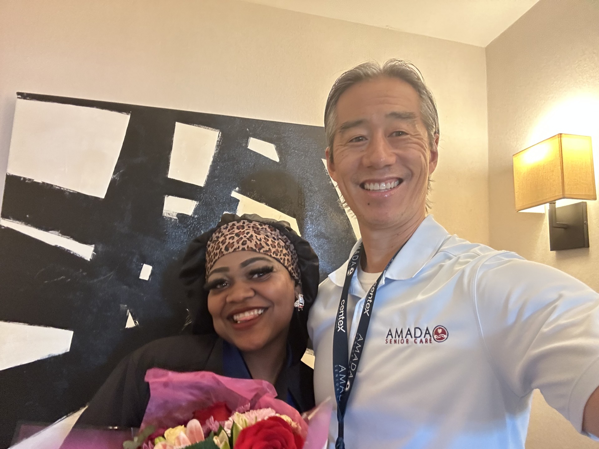 Kenesha receiving recognition certificate or award for Caregiver of the Quarter achievement.