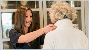 caregiver helping lady