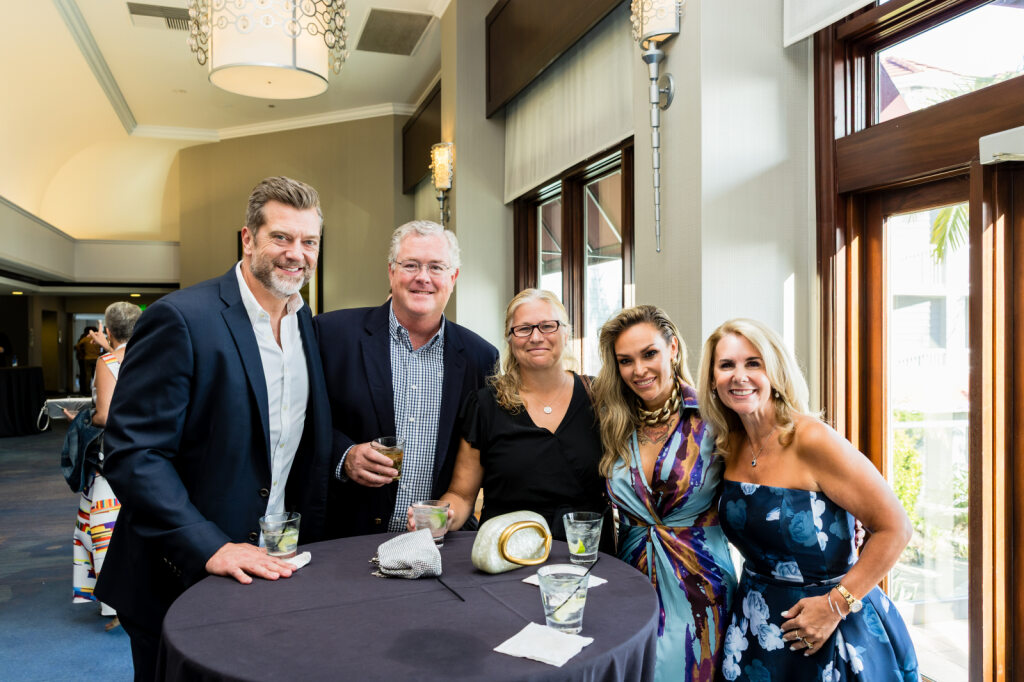 Jennifer Novy celebrates at Amada Franchise Inc.'s annual conference with fellow Amada Senior Care franchise owners.