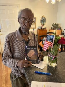 A senior veteran holding an American flag in St. Louis