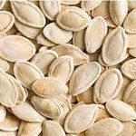 Close-up of a handful of pumpkin seeds.