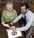 Amada advisor reviewing a long-term care insurance policy with a family