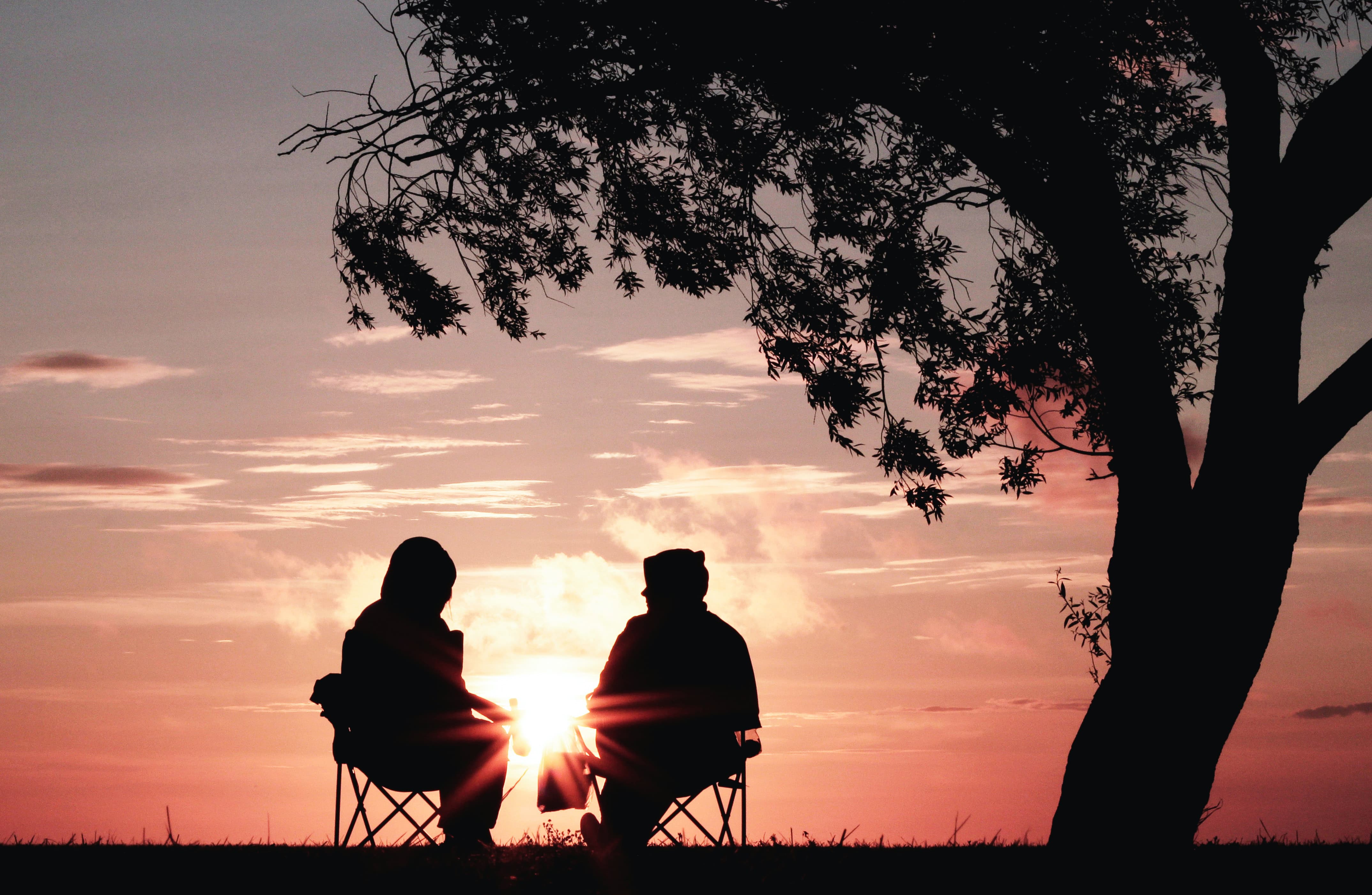two people watching sunset